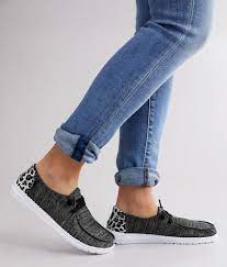Hey dude shoes show that comfort doesn't have to mean boring, with a variety of different designs that fit whatever your interests are. Hey Dude Wendy Stretch Shoe Women S Shoes In Black Grey Buckle How To Stretch Shoes Women Shoes Shoes