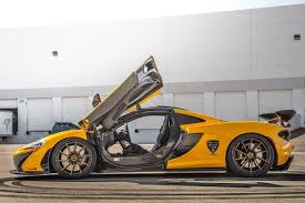 Volcano Yellow Mclaren P1 On Giovanna Wheels Side View Doors Up Gallery Mclaren P1 Mclaren Mclaren Cars