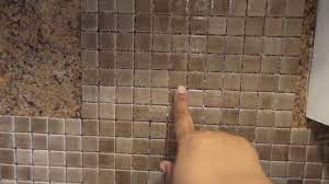The only physically difficult part of the job is removing the old backsplash. How To Install A Glass Tile Back Splash Over Formica Part 1 Youtube