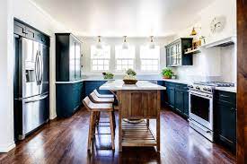 A contemporary kitchen style with dark elements creates a minimalistic design. 75 Beautiful Farmhouse Dark Wood Floor Kitchen Pictures Ideas August 2021 Houzz