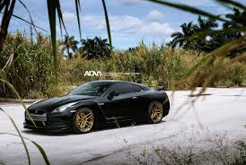 Black And Gold Rims When Luxury Meets Performance Black Nissan Gt R Fitted With Gold Adv1 Wheels Nissan Nissan Gt R Nissan Infiniti