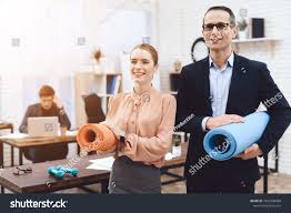 Office Staff Hold Gymnastic Mats They Work In A Business Office They Are Preparing To Rest Ad Spon Gymnastic M Gymnastics Mats Gymnastics Stock Photos