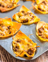 Spoon on any remaining sauce from the bottom of the bowl of slaw. Taco Wonton Cups
