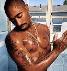This tattoo is a tribute to his song 'f**k the world'. Decrypt The Meaning Of Tupac Shakur S Most Iconic Tattoos Film Daily
