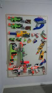 These products work great for organizing, storing, and displaying . Pegboard Nerf Gun Rack Shefalitayal