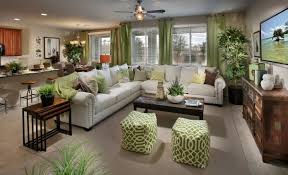 We Love The Pops Of Green Used To Decorate This Living Space From Lennar Las Vegas What Are Your Thoughts Home New Home Communities Home Living Room