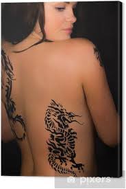 May 15, 2020 · back and upper arm tattoos, for instance, are usually concealed with clothing without you even having to try. Beautiful Female With Tribal Tattoos On Her Back Canvas Print Pixers We Live To Change