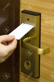 The key card door lock is triggered once the magnetic strip is read and verified by the hotel door card reader. A Hand Inserting Keycard In The Electronic Lock Stock Photo Picture And Royalty Free Image Image 712724