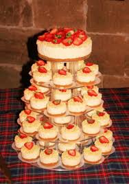 We Re Going To Have Mini Cheesecakes For Our Wedding Cake Something Like This Only With Different Fr Cheesecake Wedding Cake Wedding Cheesecake Wedding Cakes