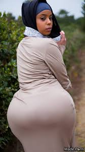Porn image of pussy juice looking at viewer big ass hijab oiled body fully  clothed looking back created by AI