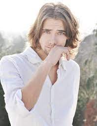 White Shirt Blonde Hair Medium Length Hairstyles For Men Green Eyes Long Hair Styles Men Mens Hairstyles Long Hair Styles