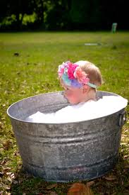 A baby bathtub will help you prop up a wriggling newborn. 11 Month Old Photoshoot In A Bubble Bath Katelynmurphyphotography Babyphotos Baby Photos Newborn Photography Photography Poses