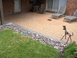 A french drain is a trench filled with a perforated pipe and gravel that allows water to drain naturally from your yard. All Sizes Pavers With French Drain Flickr Photo Sharing