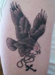 Flying Eagle With Cross Amulet Tattoo