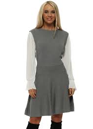 This way, we help them retain their shape and reduce energy consumption. Laetitia Mem Grey Shirt Sleeve Knitted Pinafore Dress Designer Desirables