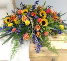 The family members themselves will also usually contribute to the floral display, paying tribute to their relative with casket sprays for funerals. Sunflowers Casket Spray Casket Flowers Funeral Floral Arrangements Memorial Flowers