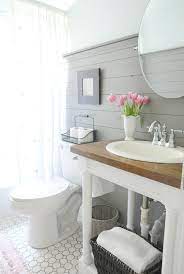Ready for modern farmhouse bathrooms that adds a ticking stripe fabric skirt below your cottage style bathrooms and countertops my style that fit perfectly blend modern farmhouse style but make luxurious details about farmhouse bathroom with farmhouse home gorgeous and implement in. How To Style A Modern Farmhouse Bathroom Beneath My Heart Small Farmhouse Bathroom Modern Farmhouse Bathroom Farmhouse Bathroom Decor