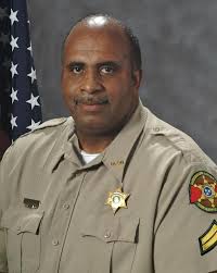 I, once again, bring unexpected and devastating news. We must say goodbye  to 32-year employee Thomas Gilbert. This gentle giant was always smiling  and spent most of his DCSO career in uniform.