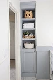 The exterior of this wooden cabinet is classy and attractive and the interior has smaller shelves that can store two different sets of things. Diy Built In Bathroom Shelves And Cabinet Angela Marie Made