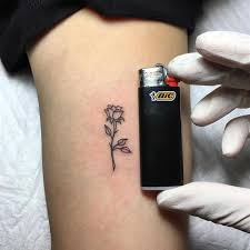 Super Small Black Rose Tattoo On The Arm Little Rose Tattoos Small Rose Tattoo Tiny Rose Tattoos