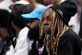 File - In This Nov. 13, 2012 File Photo Entertainer Lil' Wayne Attends The  Duke-Kentucky Ncaa College Basketball Game At The Georgia Dome In Atlanta. Lil  Wayne Says He'S An Epileptic And
