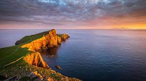 A portrait telephoto view of the landscape version below. Neist Point Lighthouse Skye United Kingdom