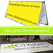 The horizon is well defined and the outline of objects might be visible without artificial light. Roadside Banner Frame With Two Graphics Banner Roadside Church Outdoor