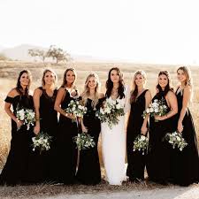 Bridesmaids In Black The Bride In All White And Tons Of Greenery Creamy Florals To Tie The Black Bridal Parties Black Bridesmaid Dresses Black Bridesmaids