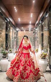 Photo Of Red And Gold Bridal Lehenga With Zardozi Work Twirling Bride Red Bridal Lehenga Bridal Lehenga Red Punjabi Wedding Dress Bridal Outfits