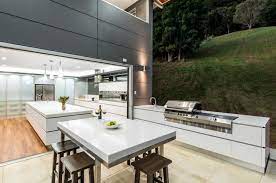Luxury living space with your pool construction project may include a beautiful bar and a focal fireplace feature. 30 Fresh And Modern Outdoor Kitchens