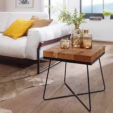 The wood is sanded lightly, very smooth to the touch, but the nicks, nail holes and patina are left to give it a nice, worn feel to it. Heather Wood Side Table With Metal Legs Decornation