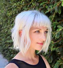 Check Out This Platinum Blonde Bob The Platinum Color And Short Bangs Gives This Look A Moder Blonde Hair With Bangs Platinum Blonde Bob Blonde Bob With Bangs