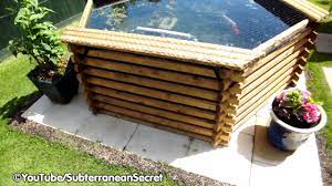 Add the pump and filter from the pond kit, fill with water and switch on. Raised Wooden Norlog 400 Gallon Garden Fishpond Youtube
