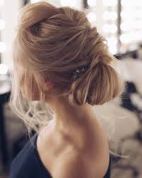 The messy low updo is an ideal choice for a romantic look. Beautiful Messy Bridal Hair Updos Hair Styles Wedding Hair Down Wedding Hairstyles For Long Hair