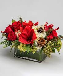 Red Amaryllis White Hydrangea And Seasonal Greens Christmas Floral Arrangements Christmas Arrangements Centerpieces Red Amaryllis