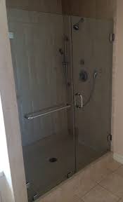 Frameless Shower Door And Panel Installed With Clips And A 20 Towel Bar In The Stationary Panel Polished Ch Glass Shower Sterling Shower Doors Shower Doors