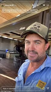 Hand in hand with his model wife, the Outback Wrangler heads into court to  fight for his freedom