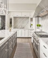 Bold beauty and elegance allow for your creativity to shine through in this masterpiece of a kitchen. Contrasting Grey Island White Perimeter Cabinetry Transitional Kitchen Chicago By Abruzzo Kitchen Bath Houzz