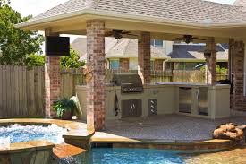 The pool surround and patio are of kota stone and the topiaries are boxwood. Modern House Patio Design