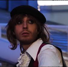 He wore a blackberry beret…the kind you find at a secondhand store