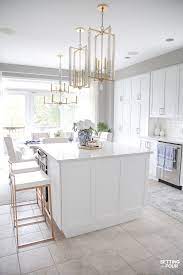 It is white with concrete stain and comfy white chairs for entertaining. Summer Kitchen Decor Ideas Summer Home Tours Setting For Four