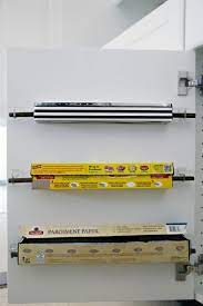This convenient storage shelf provides plenty of space for plates, cookware or ingredient jars without monopolizing space on your counter or in your pantry. 7 Brilliant Ways To Store Boxes Of Foil Parchment Paper And Plastic Wrap Astuce Rangement Astuce Rangement Cuisine Rangement Cuisine