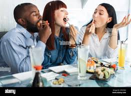2 asian girls and one black guy