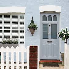 baby blue masonry paint with a blue front door and a