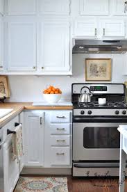 White kitchen cabinets with brass hardware. White Painted Kitchen Cabinets With Brass Hardware Jennifer Rizzo