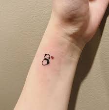 Small And Adorable Panda Unique Wrist Tattoos With A Heart Unique Wrist Tattoos Side Wrist Tattoos Believe Tattoos