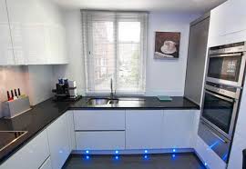 This contemporary kitchen features solid surface acrylic parapan doors in stone grey with clean lines further accentuate with concealed integrated pulls. London Wide Kitchens In Love With Kitchens Modern Kitchen Design Kitchen Layout G Shaped Kitchen