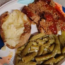 Last night's dinner was baked pork chops, roasted veggies with zucchini,  cherry tomato's, mushrooms and red onion. A side of Greek cos cous salad.  Forgot to buy the feta for the salad,