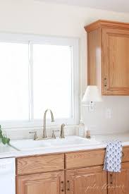 You don't have to live with stock cabinets. Updating A Kitchen With Oak Cabinets Without Painting Them