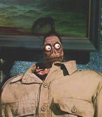 It was going to be explained in the film that he hanged himself (incompetently and very painfully), due to heartbreak. Shrunken Head Hunter Beetlejuice